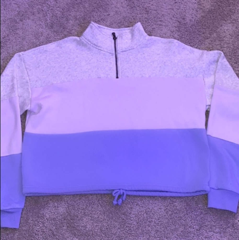 half zip up with tie to tighten at the bottom